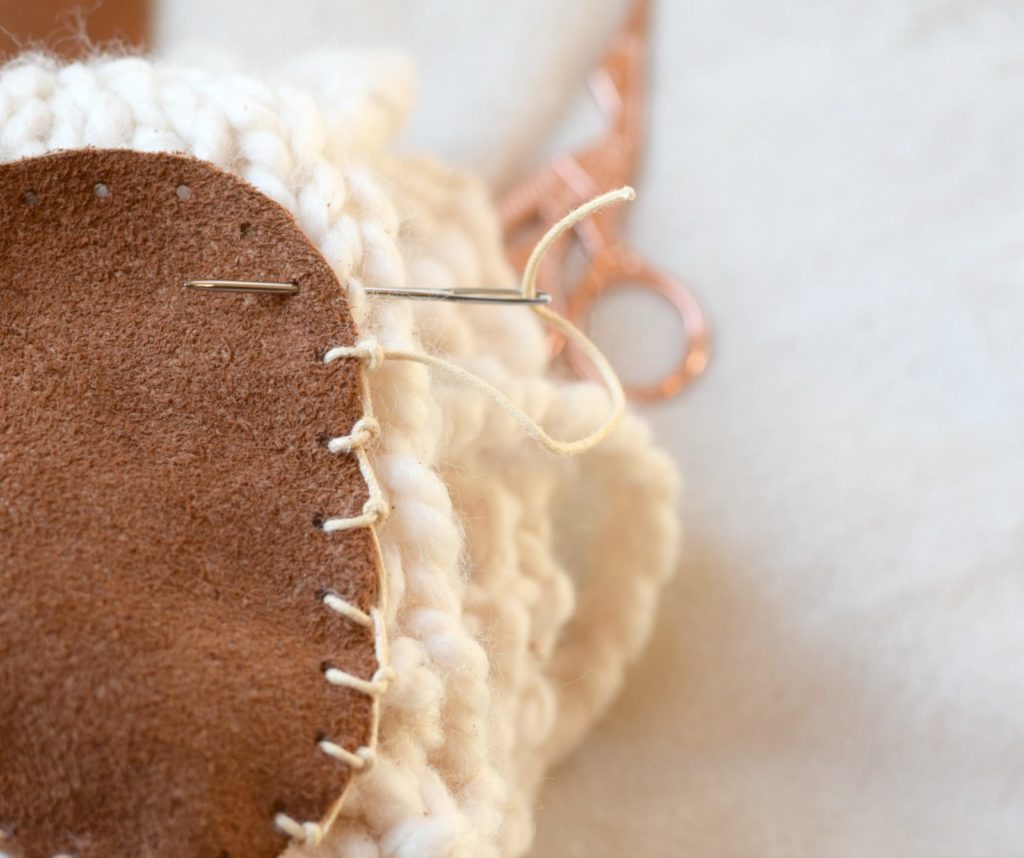 sewing soles onto crochet slippers