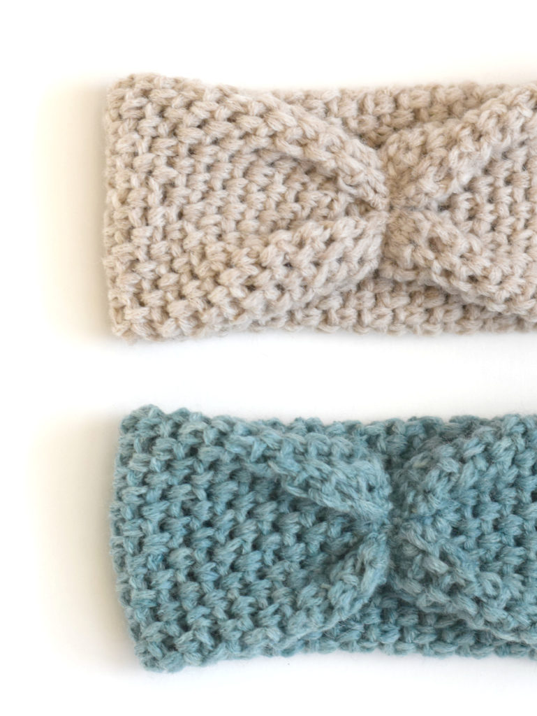 2 crochet headbands - one in cream and the other in a soft deep blue