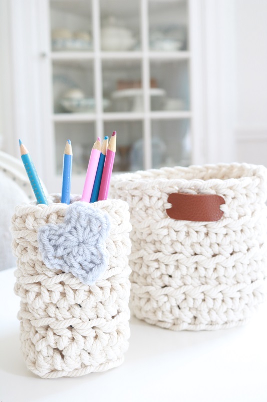 Crochet basket with knitting yarn and needles on Craiyon